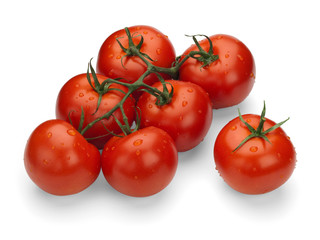 Red tomatoes on a green branch