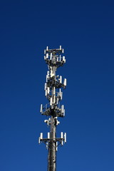 Fototapeta na wymiar Cell Phone Tower on Dark Blue