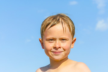 portrait of cute boy at the beach