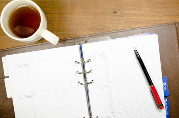 tea cup with notebook