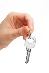 hand holding key isolated on white