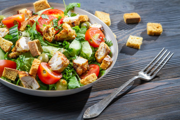 Healthy chicken salad with fresh vegetables and croutons