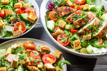 Closeup of three healthy salads with vegetables