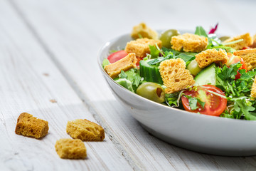 Close-up on a fresh arugula salad with tomatoes