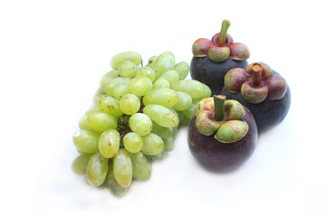 Grapes and Mangosteen isolated on white