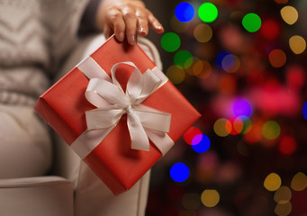 Closeup on Christmas present box in woman hand