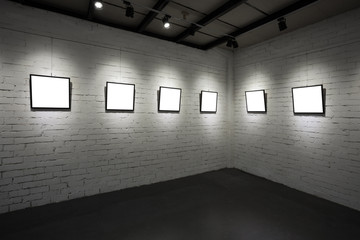 frames on white wall in art museum