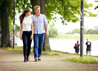 Obraz premium Couple in Love Strolling in a Park