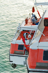 Men working on a cruise ship