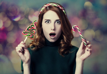 Obraz premium Beautiful women with candy Christmas tree.