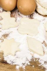 Fototapeta na wymiar Christmas baking background:raw Christmas cookies, dough,