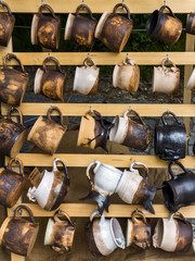 Ceramic mugs at market.