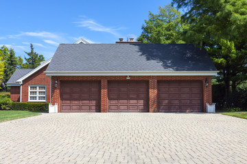Traditional American Garage With Dark Wooden Door