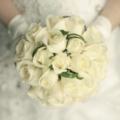 wedding bouquet at bride's hands. studio shot