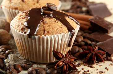 tasty muffin cakes with chocolate, spices and coffee seeds,