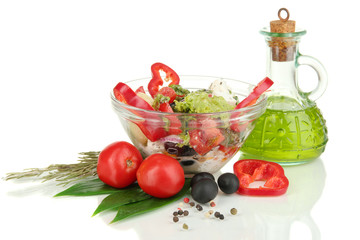 Fresh greek salad in glass bowl isolated on white