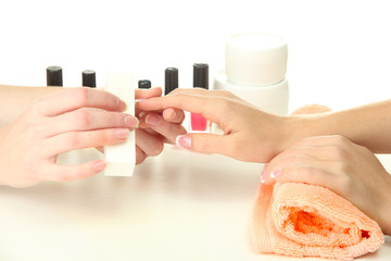 Manicure process in beauty salon, close up