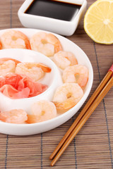 Prawns on plate with chopsticks and sauce
