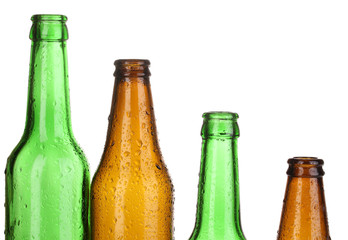 Colorful empty glass bottles isolated on white