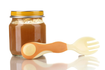 Useful and tasty baby food with beige small fork isolated