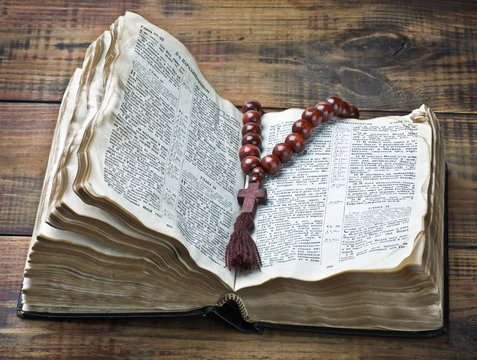 wooden rosary and the Bible