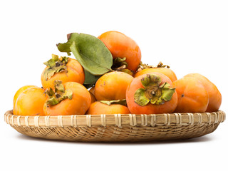 pile of orange persimmons isolated on white background