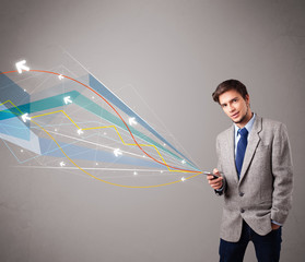 handsome young man holding a phone with colorful abstract arrows