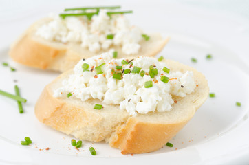 baguette with cottage cheese and green onions