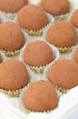 box of chocolate truffles, selective focus on center