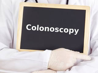 Doctor shows information on blackboard: colonoscopy
