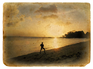 Silhouette of a man on the beach. Old postcard.