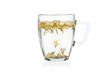 Hot jasmine tea with flowers isolated on white background