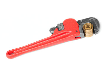 One red monkey wrench with a gold coins