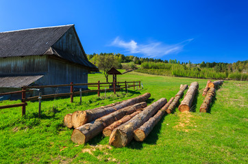 Wooden barn building timber field, Beskid Niski Mountains - obrazy, fototapety, plakaty