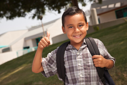 Happy Young Hispanic School Boy With Thumbs Up