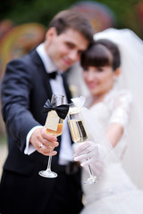 Bride and groom with glasses of champagne