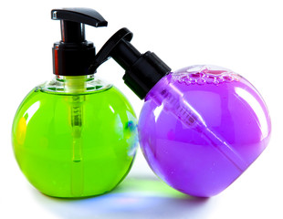 Two bright color cosmetic small bottles with the dispenser