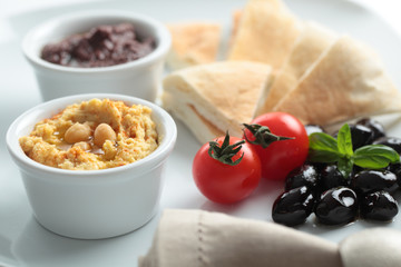 Meze with tomato, olives, and pita bread
