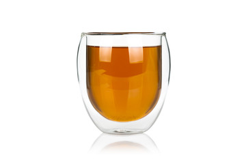 Glass cup of hot green tea isolated on white background