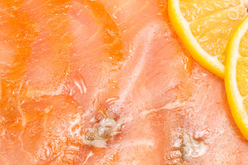 Sliced smoked salmon with lemon