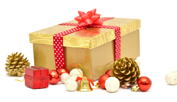 Christmas gift box with red ribbon and decoration cones