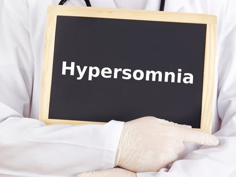 Doctor shows information on blackboard: hypersomnia