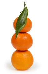 tangerines with leaves in stack