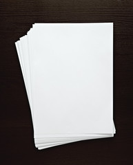 empty paper on dark desk