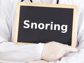 Doctor shows information on blackboard: snoring