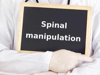 Doctor shows information: spinal manipulation