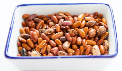 Dry raw beans in a square container