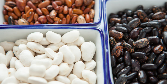 Different types of beans in containers