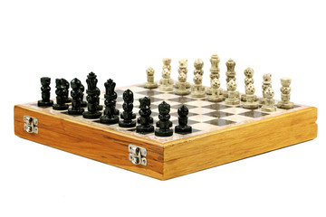 Old Decorative Chessboard with Figurines in Perspective