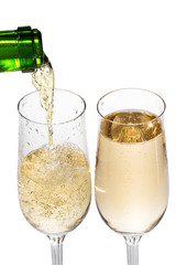 Champagne pouring in two glasses